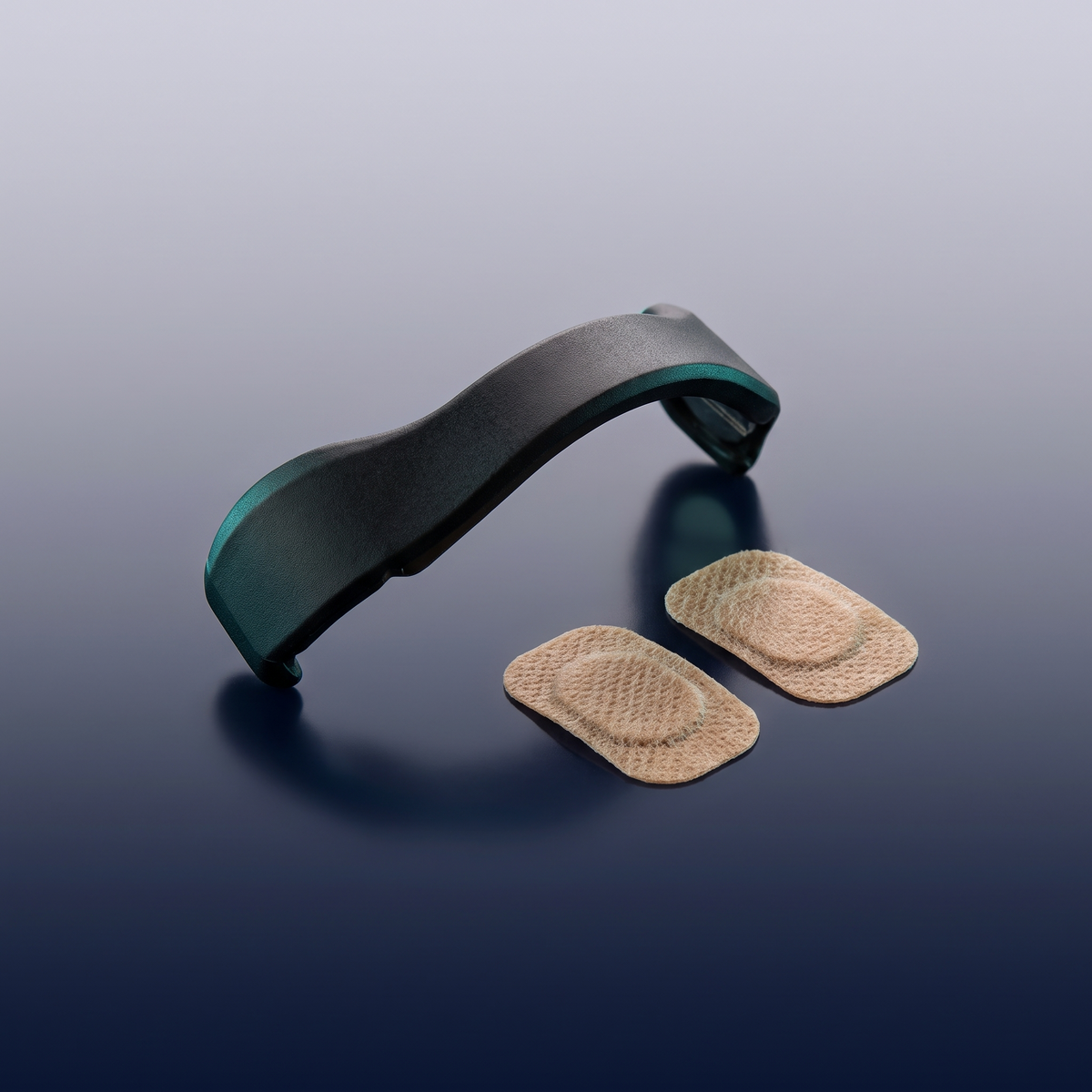 The Tezz AirGrip magnetic bridge with its two gentle adhesive pads